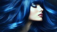 Young Asian woman with vibrant blue hair and red lips in profile view against dark background, eyes closed, showing professional hair coloring and styling for beauty industry.