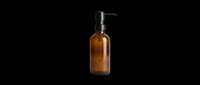Amber glass soap dispenser with black pump, isolated on transparent background, ready for T-shirt, sticker, clipart, print on demand, and sublimation design use.
