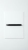 Minimalist black pen on clean white paper sheet against neutral background for office supplies and stationery design projects.