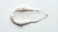 Isolated white textured cream or paste smear on clean background, suitable for cosmetics, skincare, beauty product mockups, and design applications.