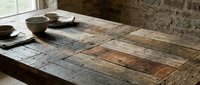 Rustic wooden table with weathered surface and ceramic bowls, perfect for interior design, home decor, and lifestyle photography projects.