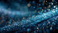 Abstract blue glitter background with sparkling bokeh lights and shimmering particles for luxury design projects and festive celebrations.