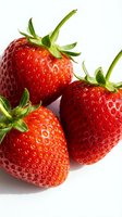 Fresh ripe strawberries with green stems isolated on white background. Use for food, nutrition, healthy eating, recipes, agriculture, and culinary projects.