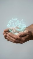 Cupped hands holding glowing green eco symbols with wind turbines, trees and leaves representing environmental protection and sustainable energy solutions.