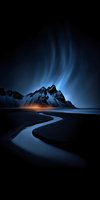 Dramatic aurora borealis dancing over snow-capped mountain peaks with winding river reflecting ethereal blue and green lights in twilight sky for nature photography.