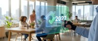 Businessman holding holographic display showing 2027 checkmark symbol in modern office with colleagues working at desks, representing future planning and business goals.