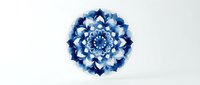 Blue and white mandala flower with layered petals isolated on white background, suitable for design projects, wallpapers, and decorative applications.