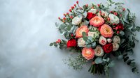 Elegant bridal bouquet with coral and white roses, red berries, and fresh eucalyptus leaves against light textured background, styled wedding photography.