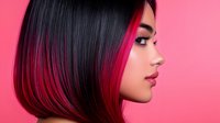 Young Asian woman with black and vibrant pink ombre hair in profile view against pink background, showcasing modern hair coloring technique and professional salon style.