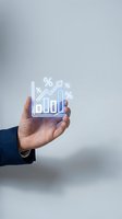 Businessman hand holding glowing holographic chart with rising bar graph and percentage symbols, representing financial growth, data analytics, and business success metrics.