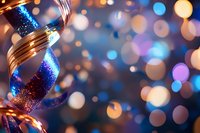 Festive blue and gold ribbon decoration against blurred bokeh lights background, creating magical holiday atmosphere.