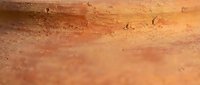 Weathered terracotta surface with natural texture and rust-colored patina, suitable for backgrounds, design elements, and artistic projects.