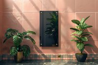 Modern interior design with tropical plants against pink wall featuring window light shadows and decorative wall panel, perfect for contemporary home decor inspiration.