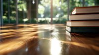 Stack of books on wooden table with natural sunlight casting dramatic shadows through window, creating warm atmospheric mood for education and reading concepts.