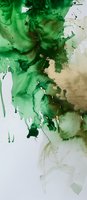 Vibrant emerald green and beige watercolor splashes blend on white background, creating dynamic abstract patterns with fluid drips and organic flowing shapes.