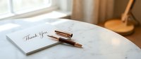 Elegant thank you note with luxury pen on marble table by window, gratitude message for business correspondence and personal communication.