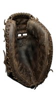 Vintage brown leather baseball glove with detailed stitching and worn texture isolated on white background for sports equipment designs.