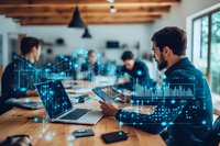 Young Asian businessman analyzing digital data visualization and charts while working with team in modern office space. Financial technology concept.