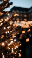 Warm golden lights illuminate evergreen branches creating magical holiday atmosphere with bokeh background for festive seasonal celebrations and decorations.