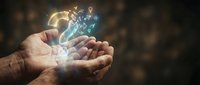 Hands holding glowing digital brain with neural network connections and light particles, representing artificial intelligence, technology innovation, and data processing for business solutions.
