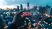 Glowing 2026 number held against blurred city skyline with bokeh lights and fireworks, creating futuristic new year celebration atmosphere at dusk.