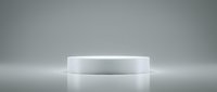 White cylindrical podium platform on reflective surface with soft gradient lighting for product display and presentation backgrounds.