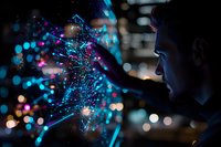 Young male silhouette interacting with glowing blue holographic network visualization against dark background with bokeh lights, representing digital innovation.