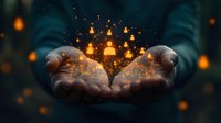 Magical glowing orange particles and light floating above cupped hands against dark background, creating mystical atmospheric effect. Concept of hope and wonder.