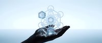 Hand holding glowing molecular structure with hexagonal chemistry symbols floating above palm against soft blue gradient background for science concepts.