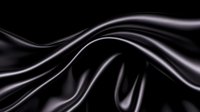 Elegant flowing black silk fabric with smooth waves and graceful curves creates dramatic contrast against dark background, highlighting luxurious textile movement.