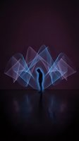 Silhouette of person standing before glowing geometric light waves in shades of blue and purple against dark background. Suitable for concepts of energy, spirituality, technology, and abstract design projects.