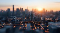 Modern cityscape with glowing digital network lines against sunset sky, showcasing urban technology infrastructure and smart city concept at dusk.