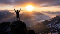 Triumphant hiker with raised arms celebrating success on mountain peak at golden sunrise with dramatic alpine landscape and misty valleys below.