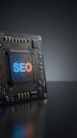 Computer circuit board with glowing SEO text for search engine optimization and digital marketing technology concepts.