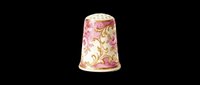 Decorative porcelain thimble with pink floral ornament and gold accents, isolated on transparent background. Ready for clipart, print-on-demand, sublimation, t-shirt design, and craft projects.