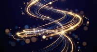 Golden light trails forming dynamic spiral curves with sparkling particles and bokeh effects on dark blue background for motion graphics.