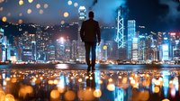 Silhouette of businessman standing on reflective surface overlooking illuminated cityscape with bokeh lights, modern skyscrapers and urban nighttime skyline.