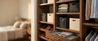 Modern walk-in closet with wooden shelving system, organized storage boxes, folded clothes, shoes and accessories for home organization and interior design.