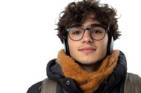 Young Hispanic male student wearing glasses, orange scarf, and headphones smiles confidently against white background, isolated portrait for education and lifestyle designs.