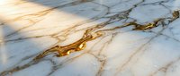 Luxurious white marble surface with natural golden veins and liquid gold accents, creating an elegant textured background for interior design, home decor, and premium product presentations.