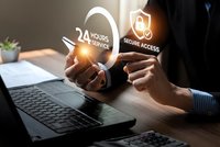 Businessman hands holding glowing security icons above laptop showing 24 hours service and secure access symbols for cybersecurity technology concepts.