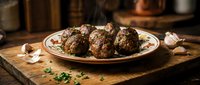 Homemade beef meatballs with herbs on rustic wooden table in warm kitchen setting for comfort food recipes and cooking blogs.