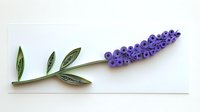 Paper quilling artwork showing purple hyacinth flower with green leaves on white background, handcrafted decorative element for spring designs.