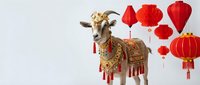 Decorated goat with golden ornaments and red tassels alongside traditional red lanterns and decorations for Chinese New Year celebration on white background.