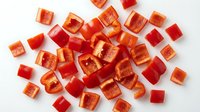 Red fruit gummy candy cubes scattered on white background, chewy sweets for snacking, confectionery products, dessert treats ready for design use.