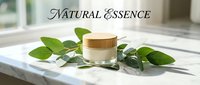 Cosmetic jar with wooden lid surrounded by fresh green leaves on marble surface, representing natural skincare and organic beauty products for wellness branding.