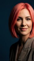 Professional businesswoman with vibrant pink hair and confident smile wearing elegant blazer against dark blue background for corporate branding.