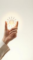 Hand holding glowing sun symbol representing renewable energy, sustainability and environmental protection concepts for business presentations.