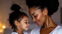 Tender moment between African American mother and daughter sharing loving embrace and gentle smiles against warm bokeh background, expressing family bond and care.