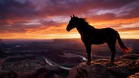 Majestic horse silhouette standing on rocky cliff against dramatic sunset sky with orange and purple clouds over vast canyon landscape.